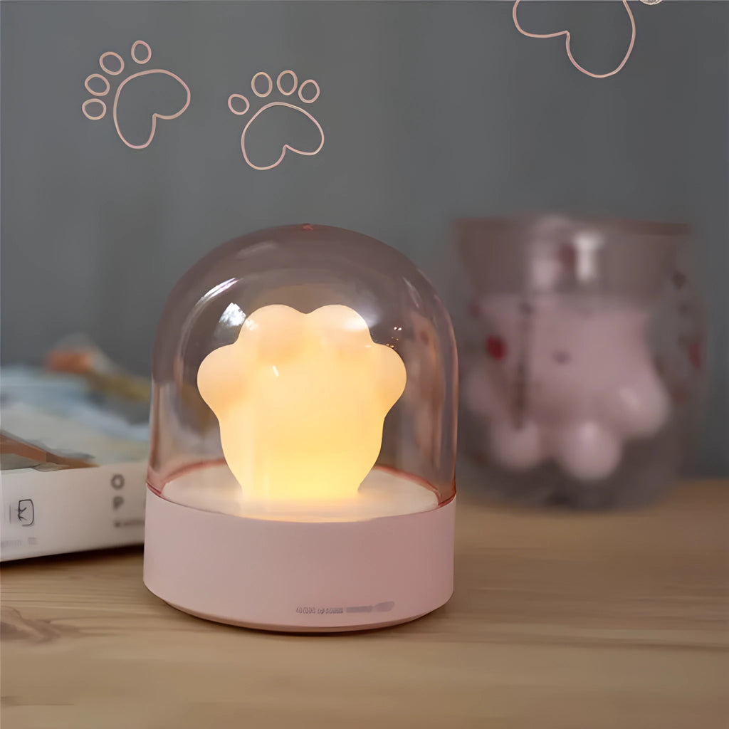 Grey or pink cat paw shaped USB rechargeable night light with rotating soft light and music box feature