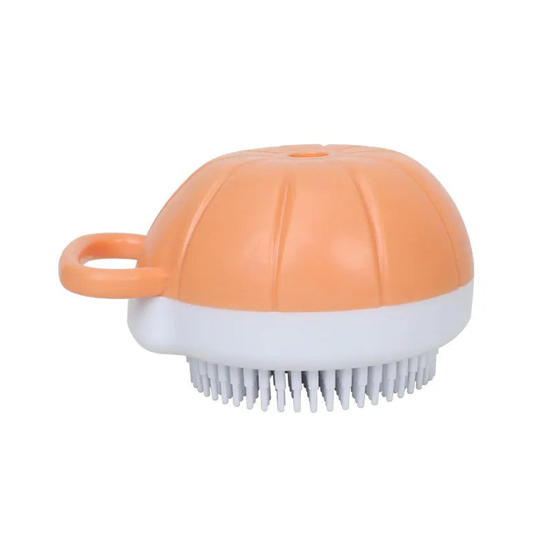 Orange TPR dog bath brush with shampoo dispenser and pumpkin-shaped grip for pet grooming
