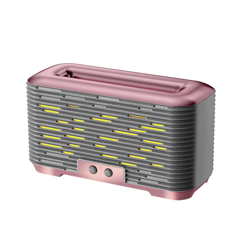 Flame aroma diffuser humidifier in gold with double-colour atmosphere light on a desktop