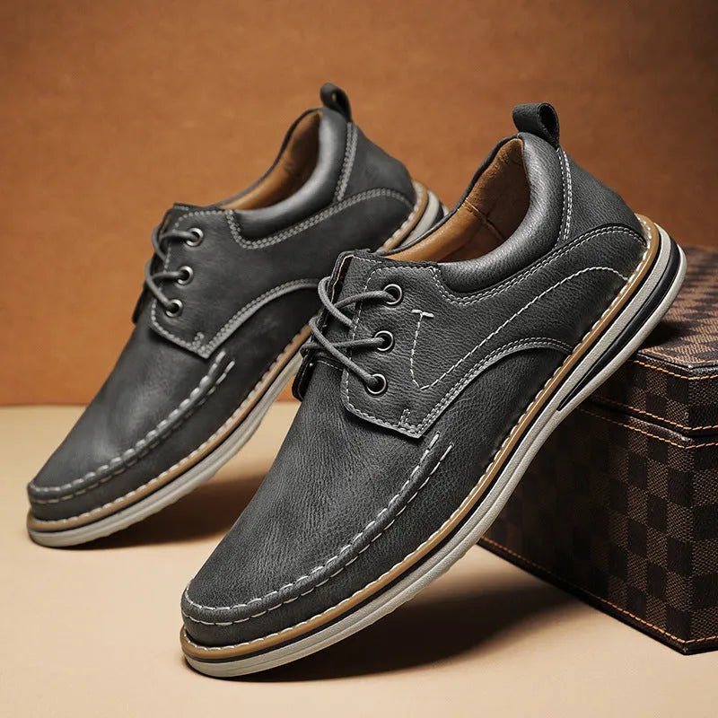 Men's black genuine leather lace-up casual shoes with round toe and stitched sole
