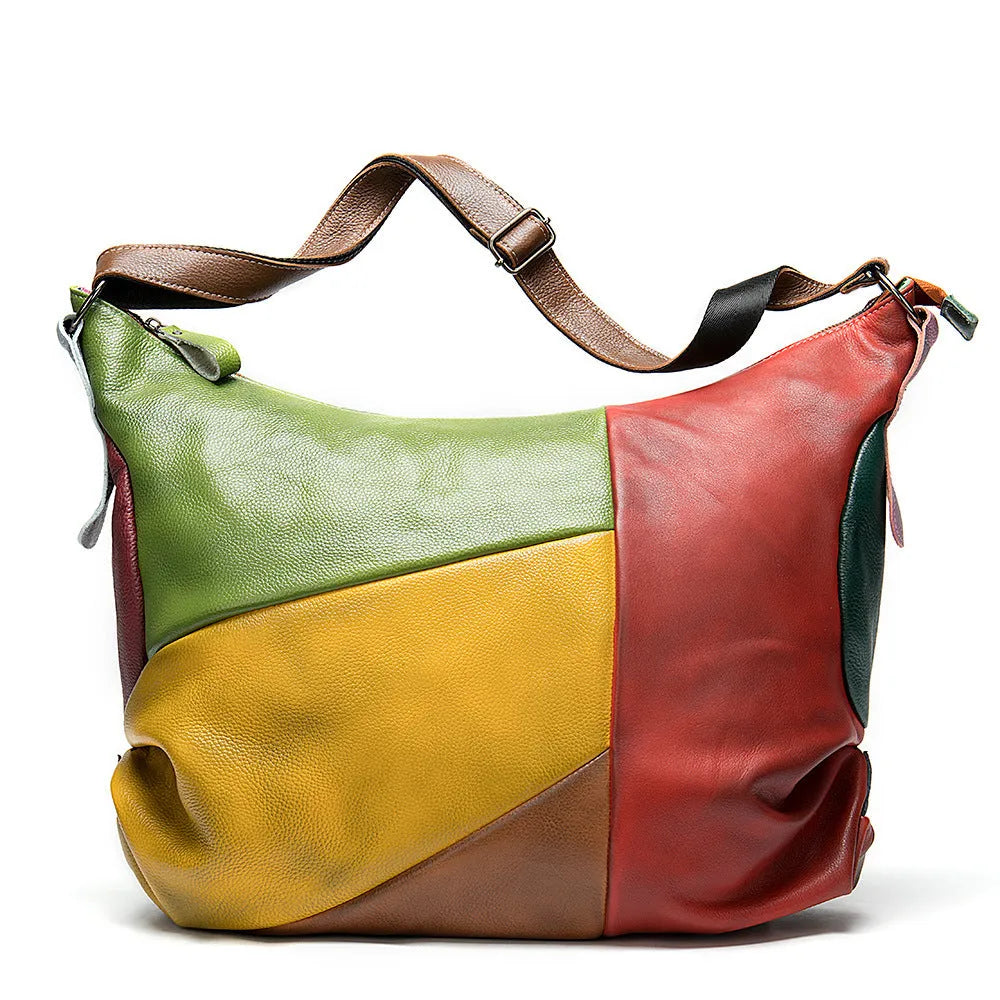 Brown cowhide leather crossbody travel bag open to show space for a 15-inch laptop and A4 documents.