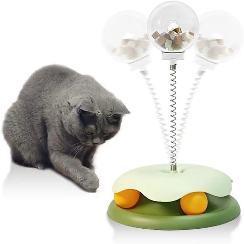 Blue and green cat treat dispenser toy with track ball for slow feeding entertainment