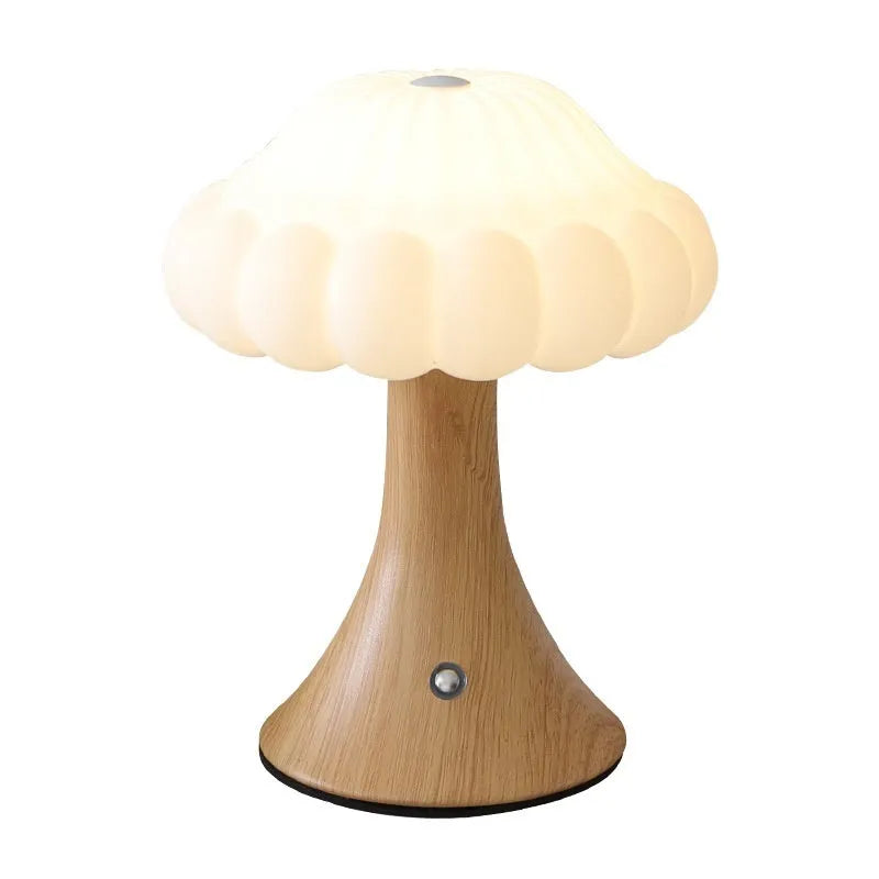 Creative mushroom-shaped night lamp in wood grain colour on a table