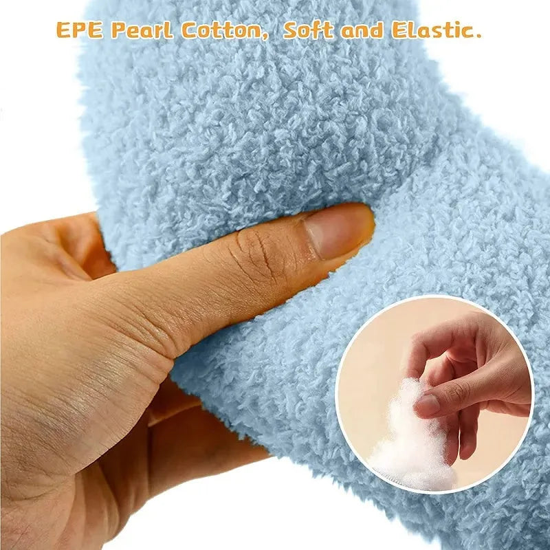 Small U-shaped plush pillow for cats and small dogs in blue, showing quilted faux fur texture.