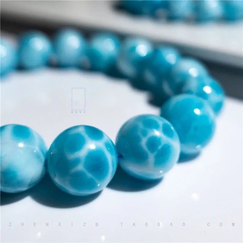 Blue unisex Bodhi bracelet with natural crystal sea-pattern stones and pearls in Maillard style.
