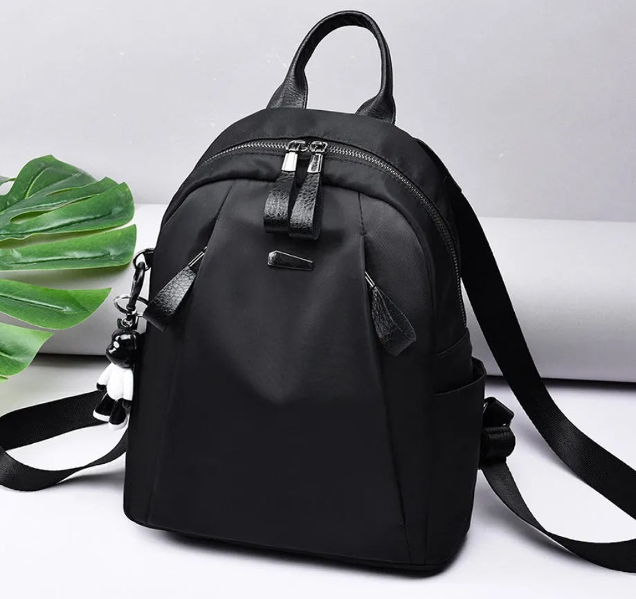 Medium Oxford cloth rucksack in wine red with double straps and internal organisation pockets