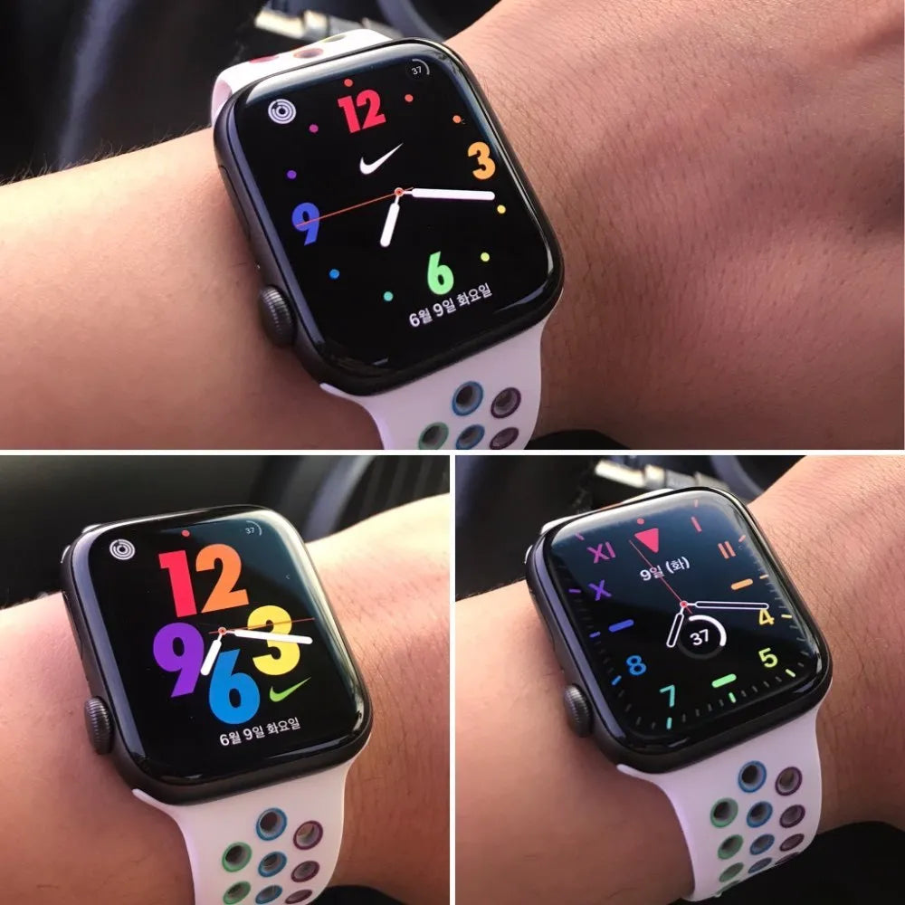 Black silicone sports wristband with a single buckle, shown next to white and rainbow colour options.