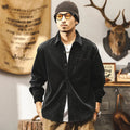 Men's loose-fit corduroy shirt jacket in red or black, showing long sleeves and button front.