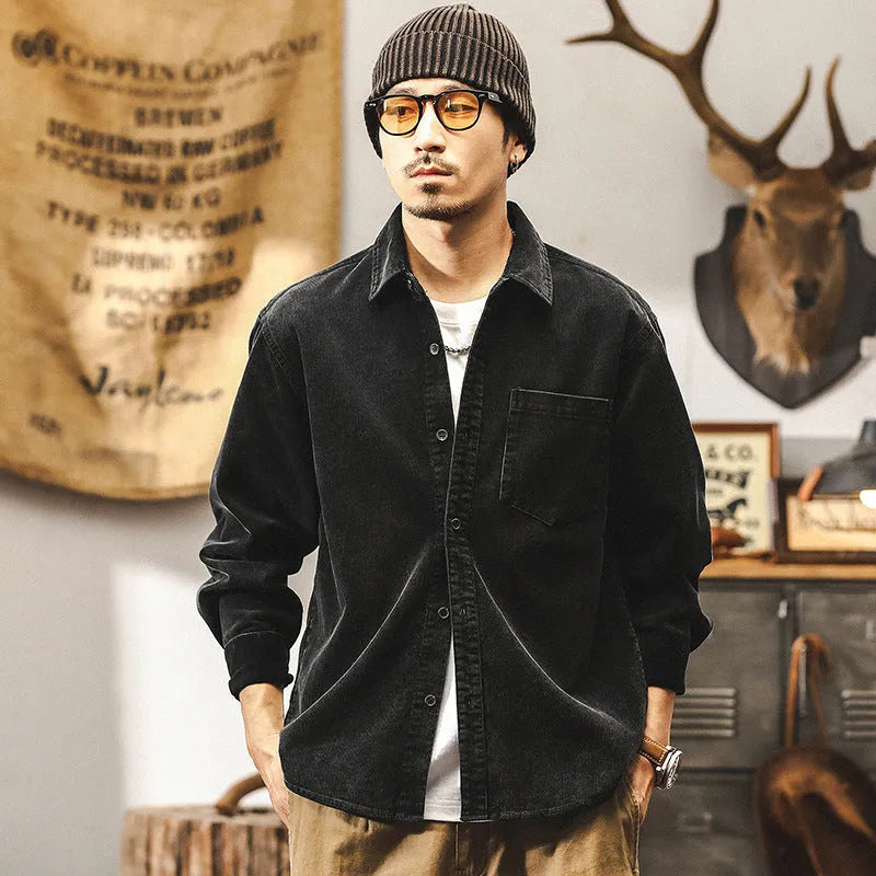 Men's loose-fit corduroy shirt jacket in red or black, showing long sleeves and button front.