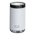 White USB jellyfish smoke ring humidifier with warm night light on a table, showing nano mist.
