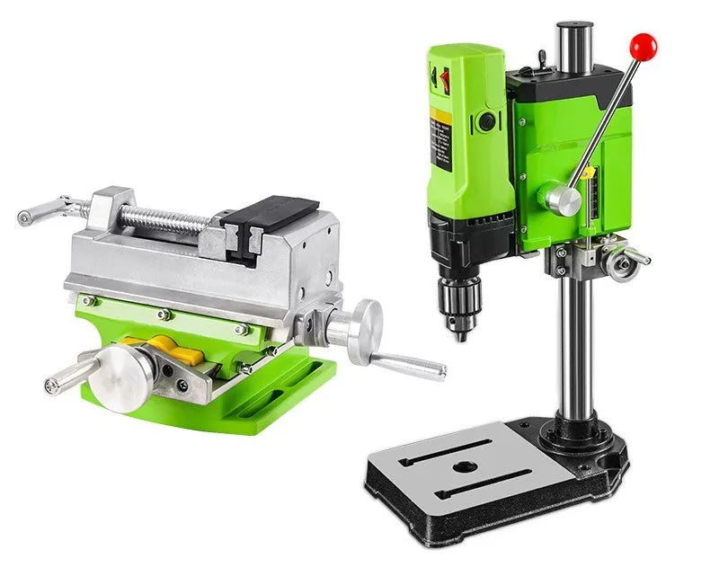 Mini bench drill and milling machine on a workbench with bench pliers.