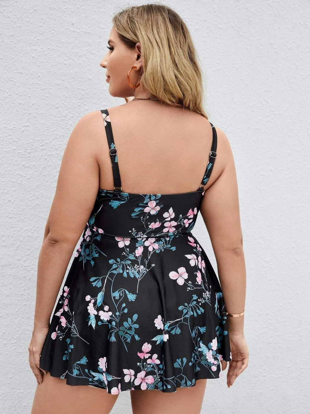 Women's one-piece swimsuit with a split colour floral print pattern on high elasticity polyester fabric.