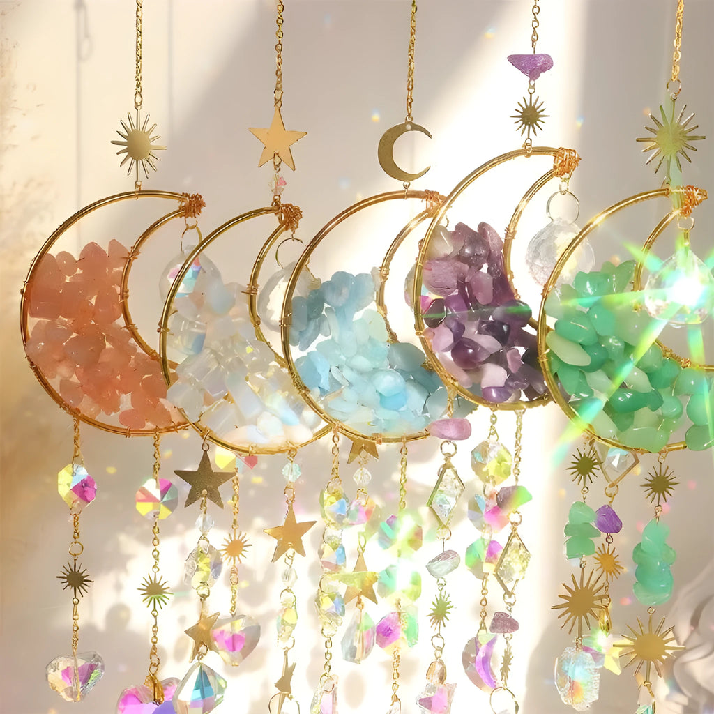 K9 crystal moon-shaped pendant on a cord for hanging in a car interior.