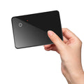 Black card-shaped pet tracking device with wireless charging and NFC capabilities