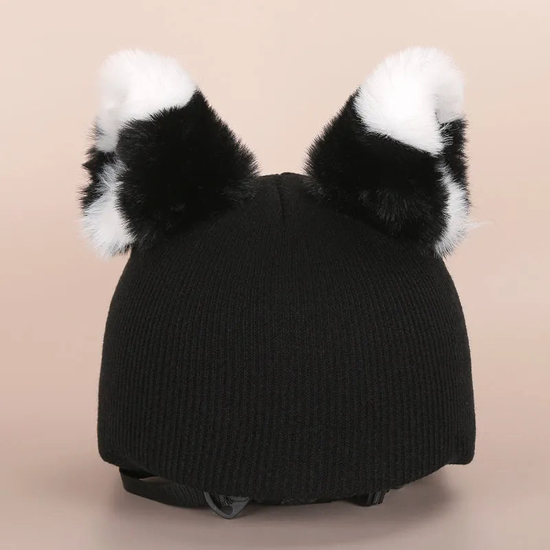 Soft plush cartoon character cover on a motorcycle helmet, showing size M and decorative ear sections.