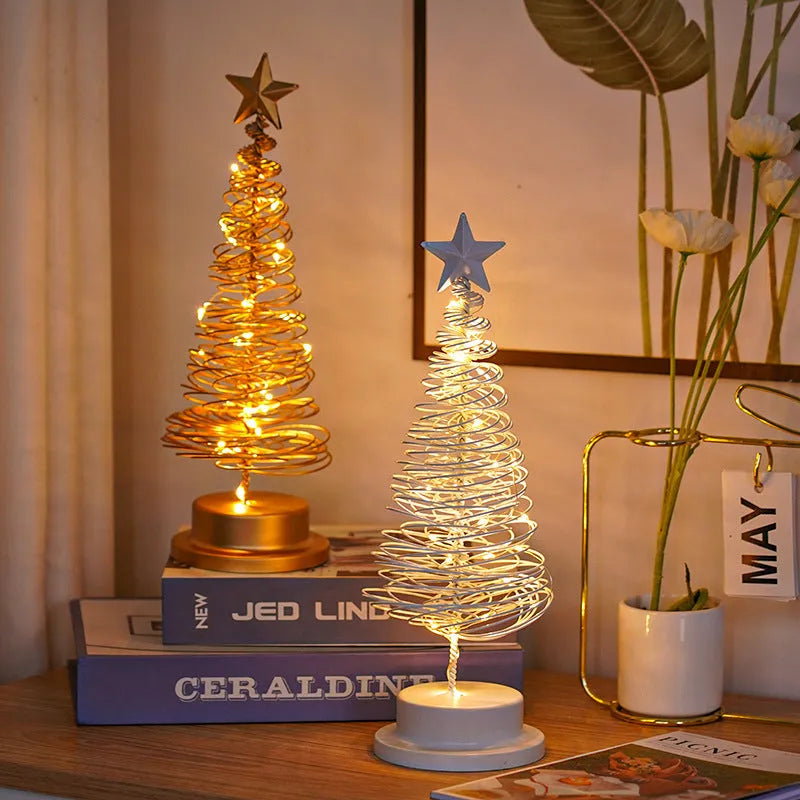 33cm tall metal LED Christmas tree ornament with warm white lights on tabletop