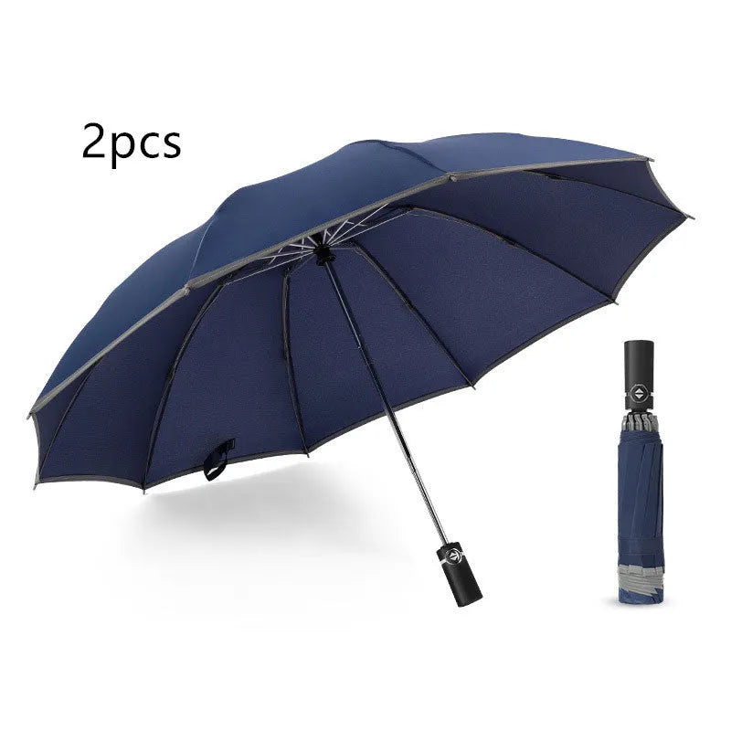 Inverted umbrella with auto close button and reflective stripes on black canopy