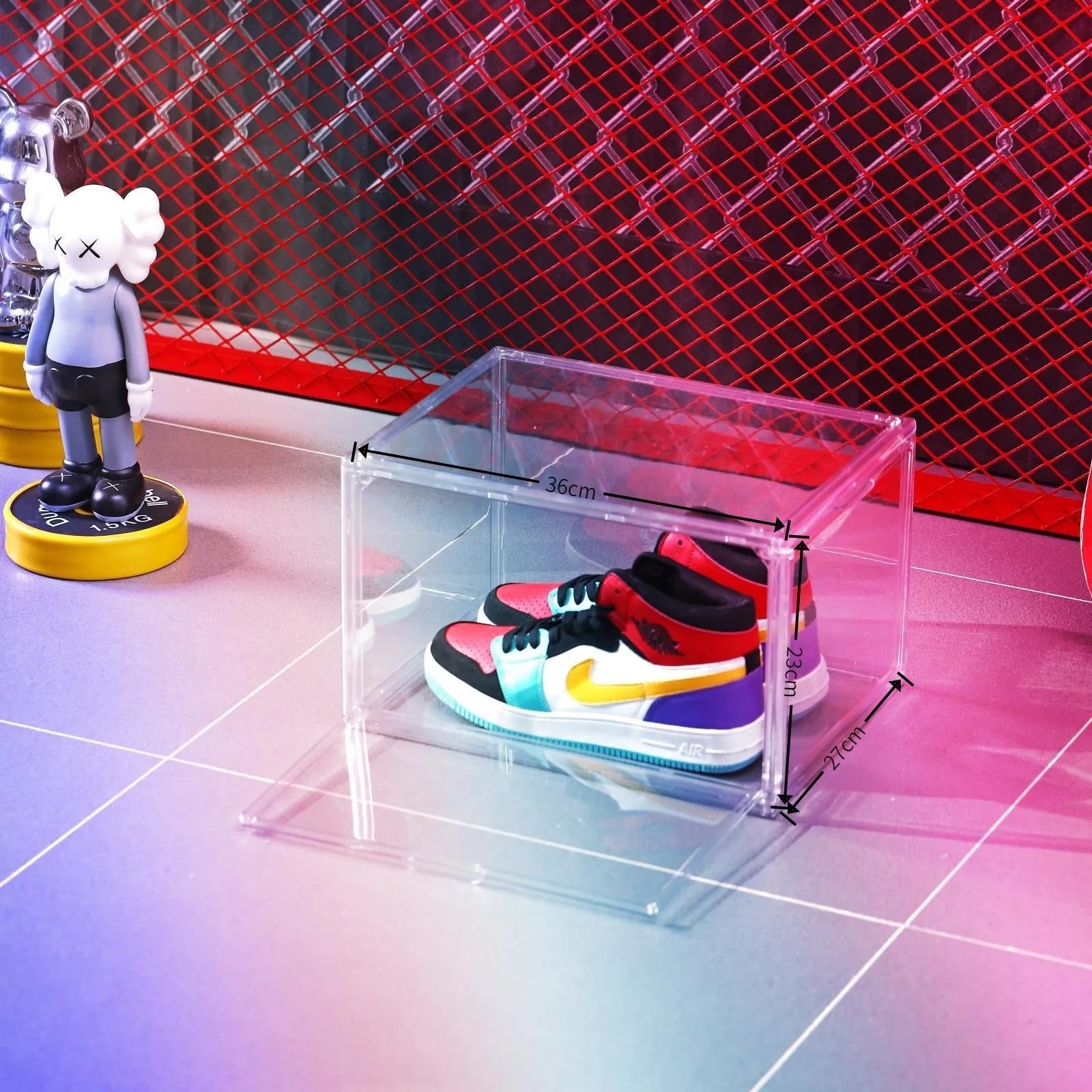 Large clear acrylic shoe storage box with a magnetic side door open, showing shoes inside.