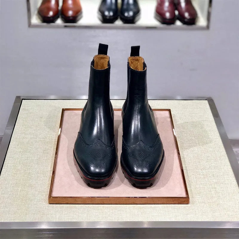 Black leather business casual high-top shoes with a plain toe and leather sole.