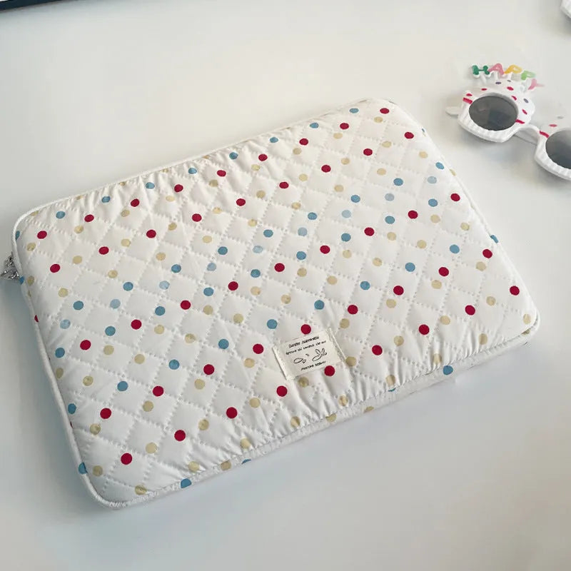 Women's polka dot laptop bag in solid colour with size options for 11, 13, and 15.6 inch computers.