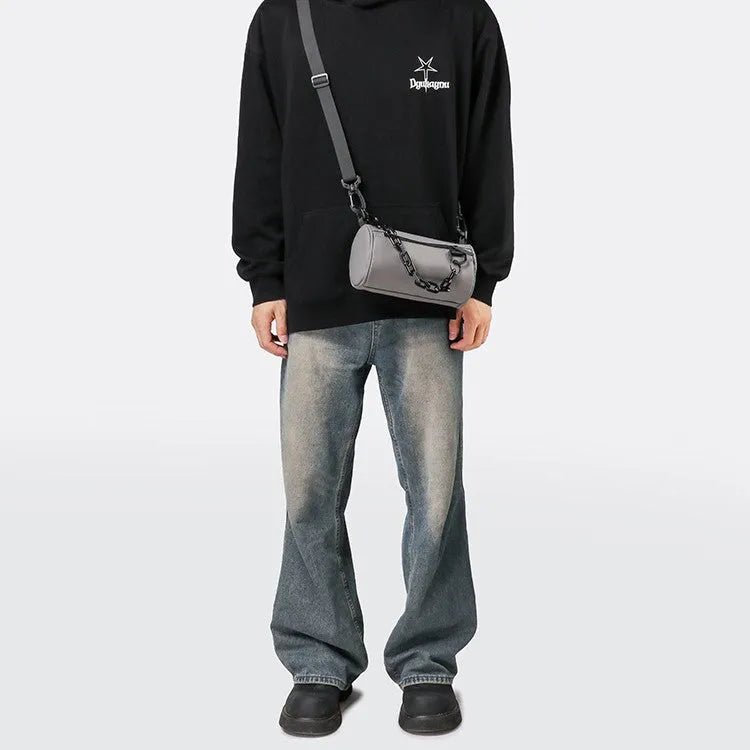 Oxford cloth crossbody messenger bag with chain details in black, grey, or orange colour.