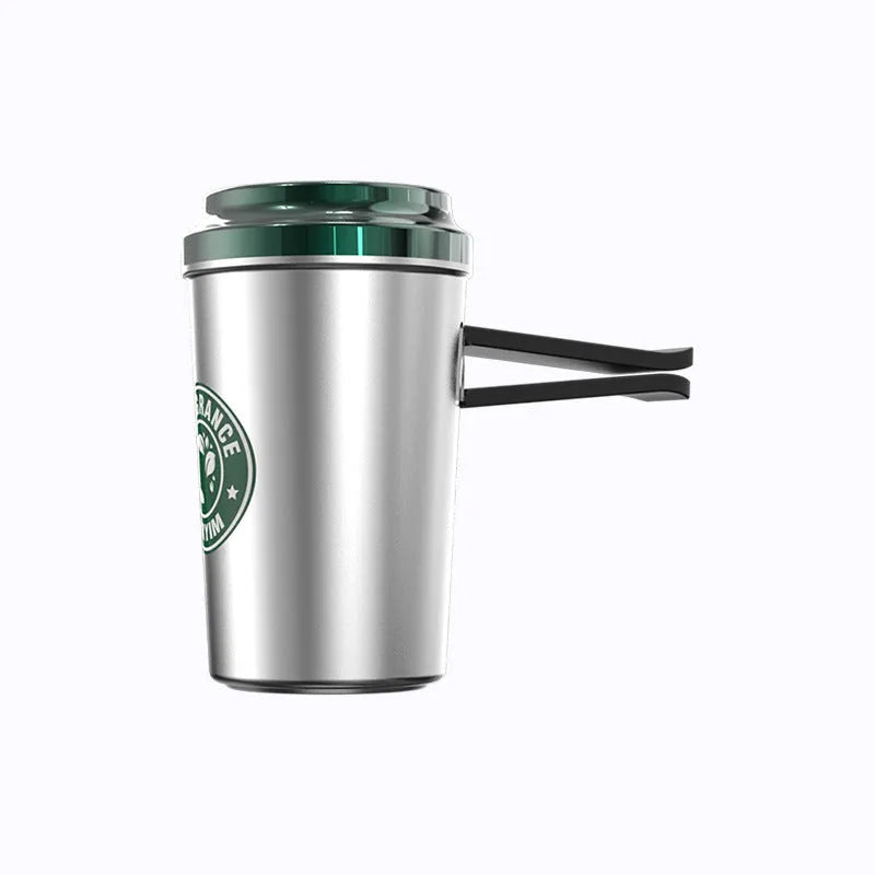 Silver alloy solid perfume seat in coffee cup shape with natural plant fragrance on a wooden desk