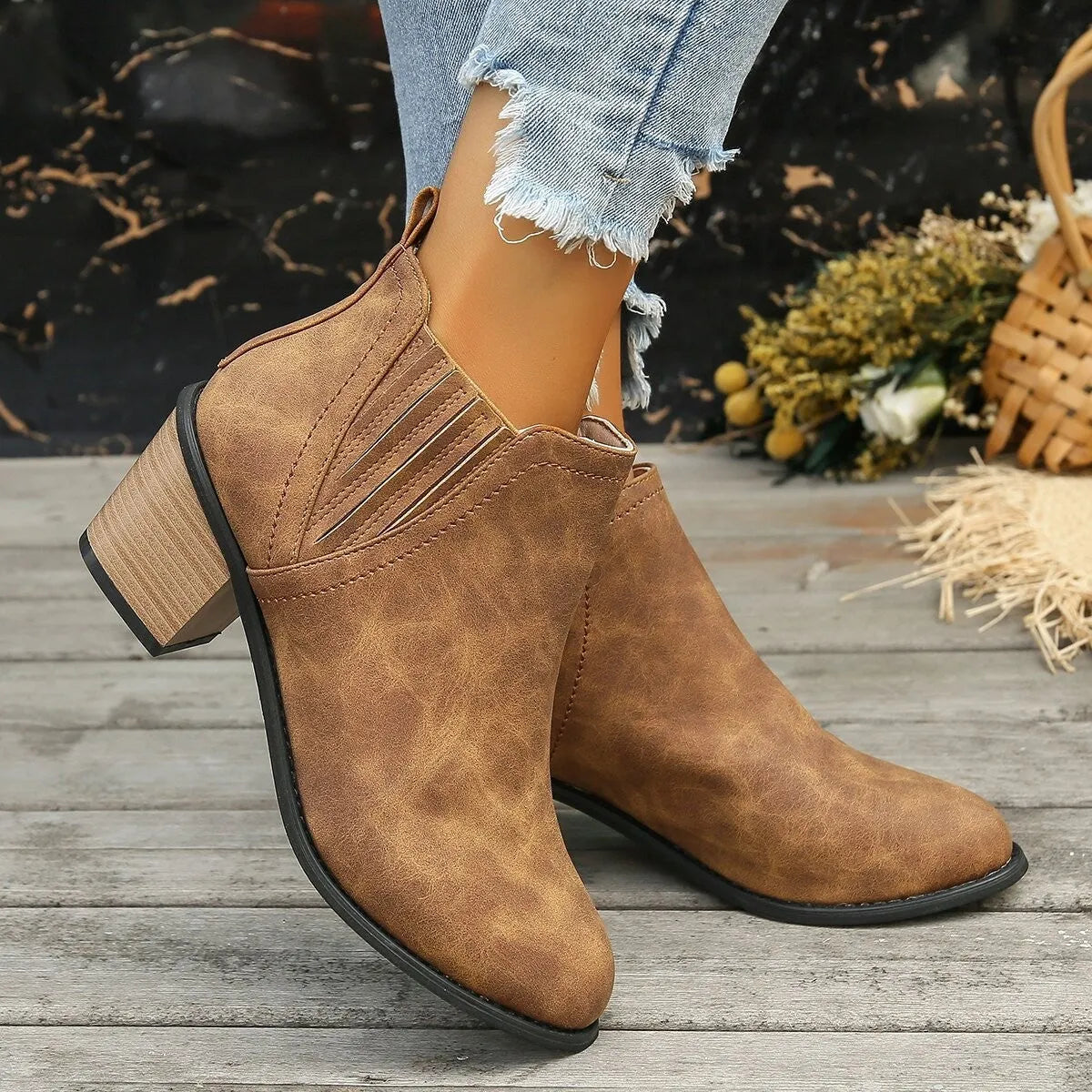 Women's black pointed toe ankle boots with thick square heel, slip-on design