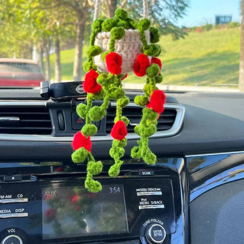 Green and white knitted wool plant ornament for car dashboard with hanging cord