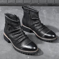 Black high-top Martin boots with side zip and horseshoe heel on a plain background.