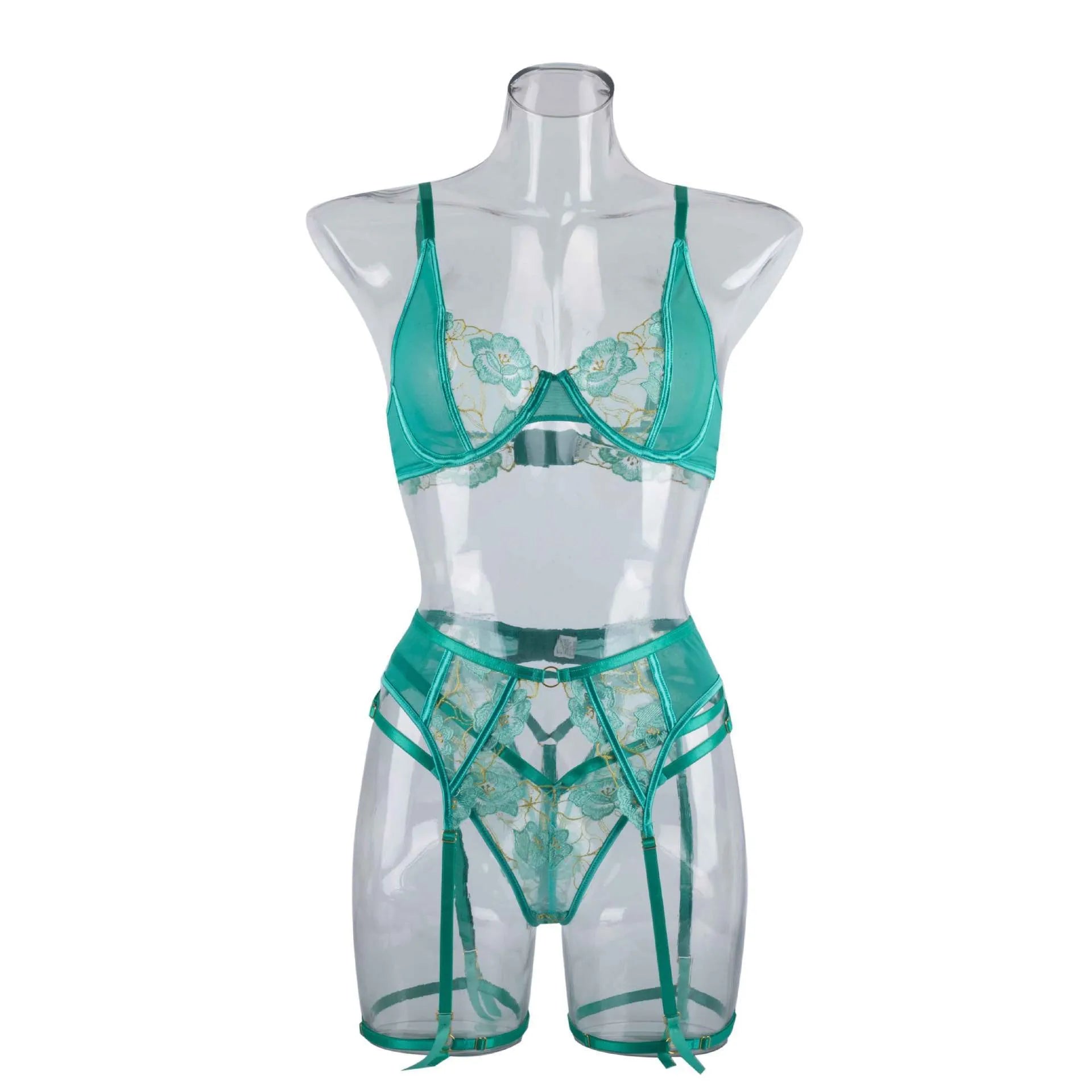 Light green women's embroidered bra and matching briefs set on a white background.