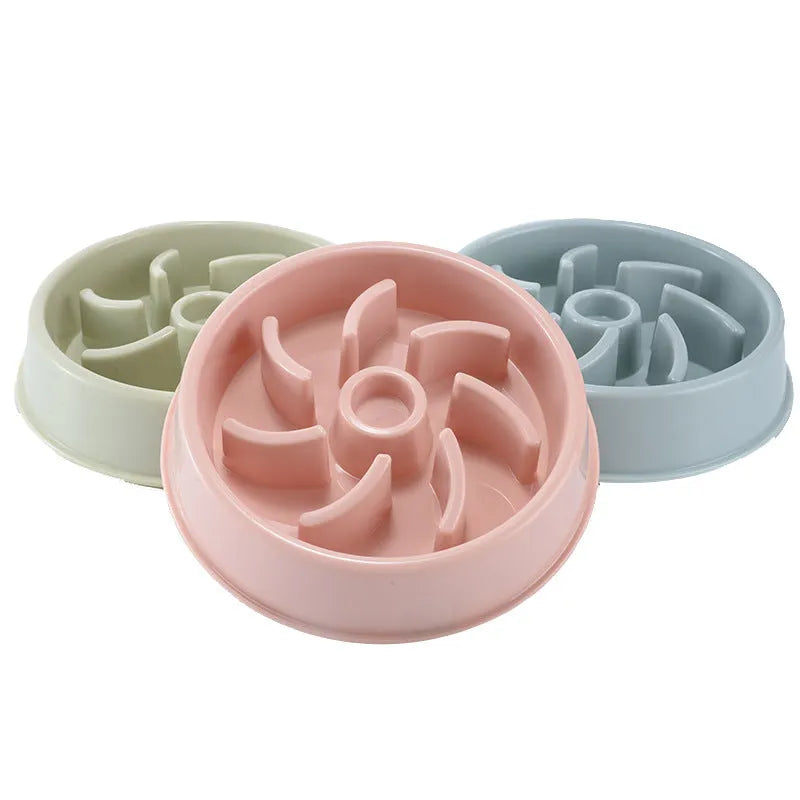 Plastic slow food bowl for dogs and cats with flower-shaped internal obstacles, pink colour, choke prevention design.