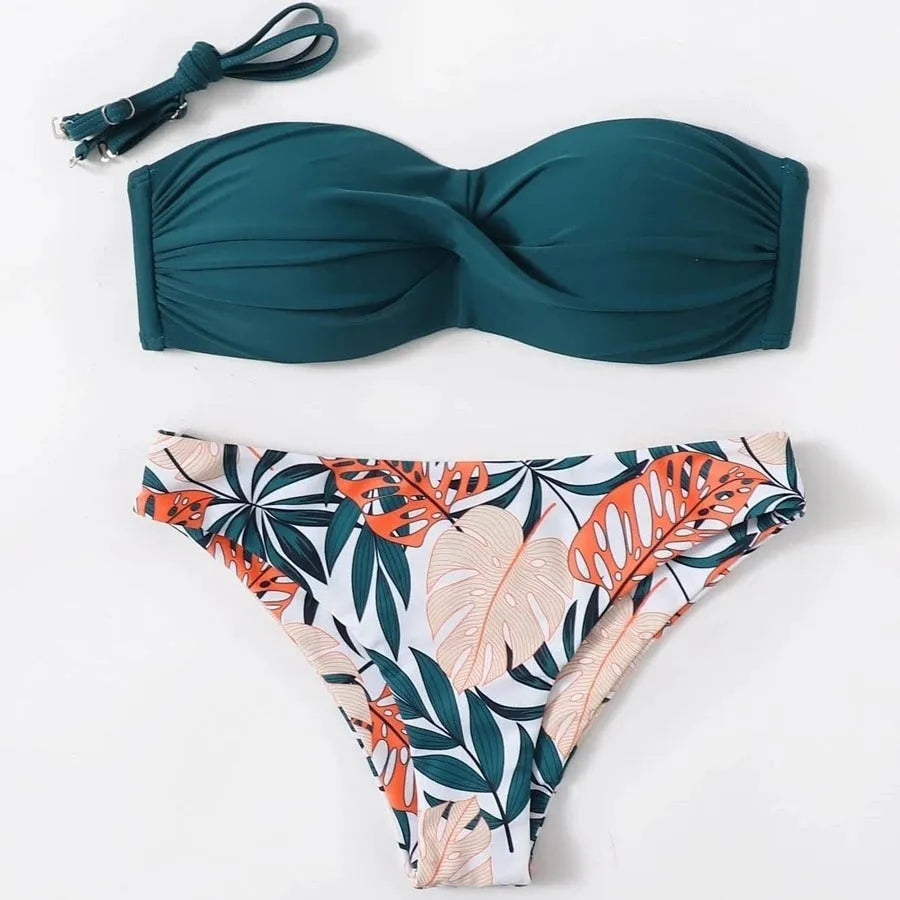 Split push up hard bag bikini swimsuit with matching briefs in multiple colours on a mannequin.
