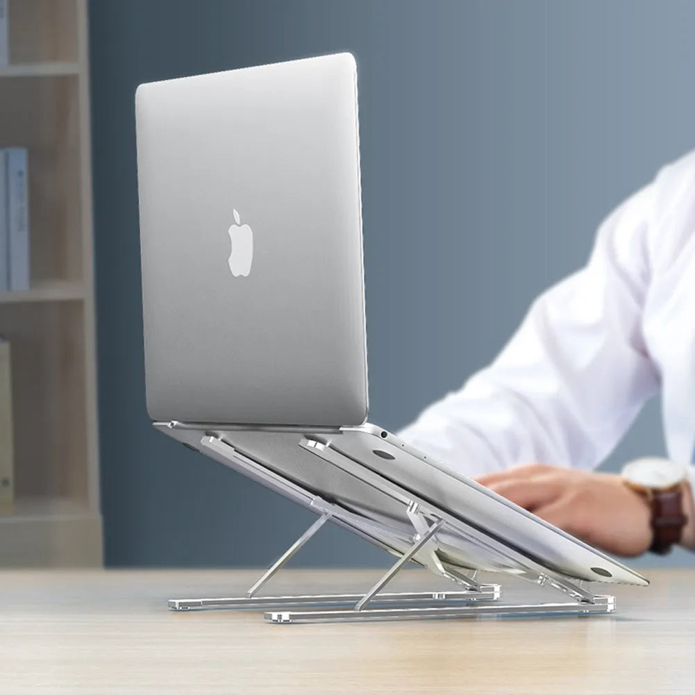 Foldable aluminium laptop stand in silver, shown open at an angle and folded flat.