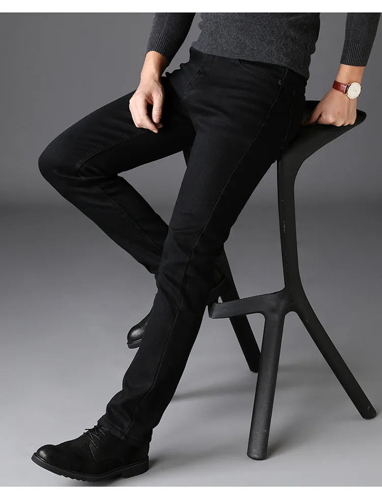 Men's slim straight black jeans made of cotton denim, flat lay