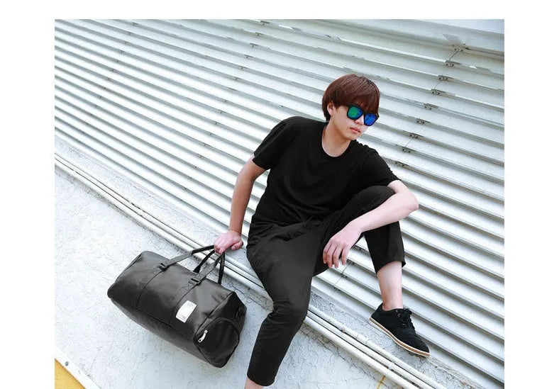 Black waterproof sports fitness bag with separate side compartments for shoes, shown in large and small sizes.