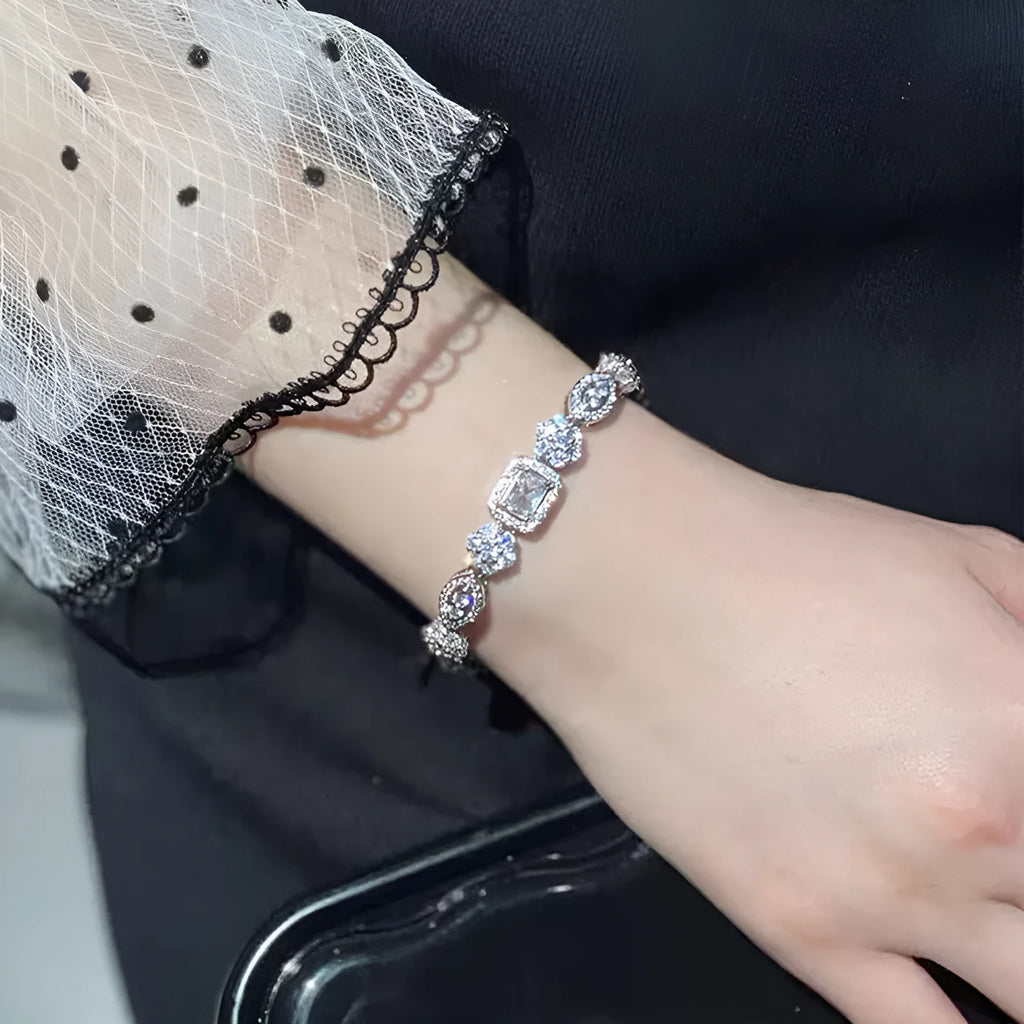 Geometric women's silver bracelet with zircon stones, shown in two length options.