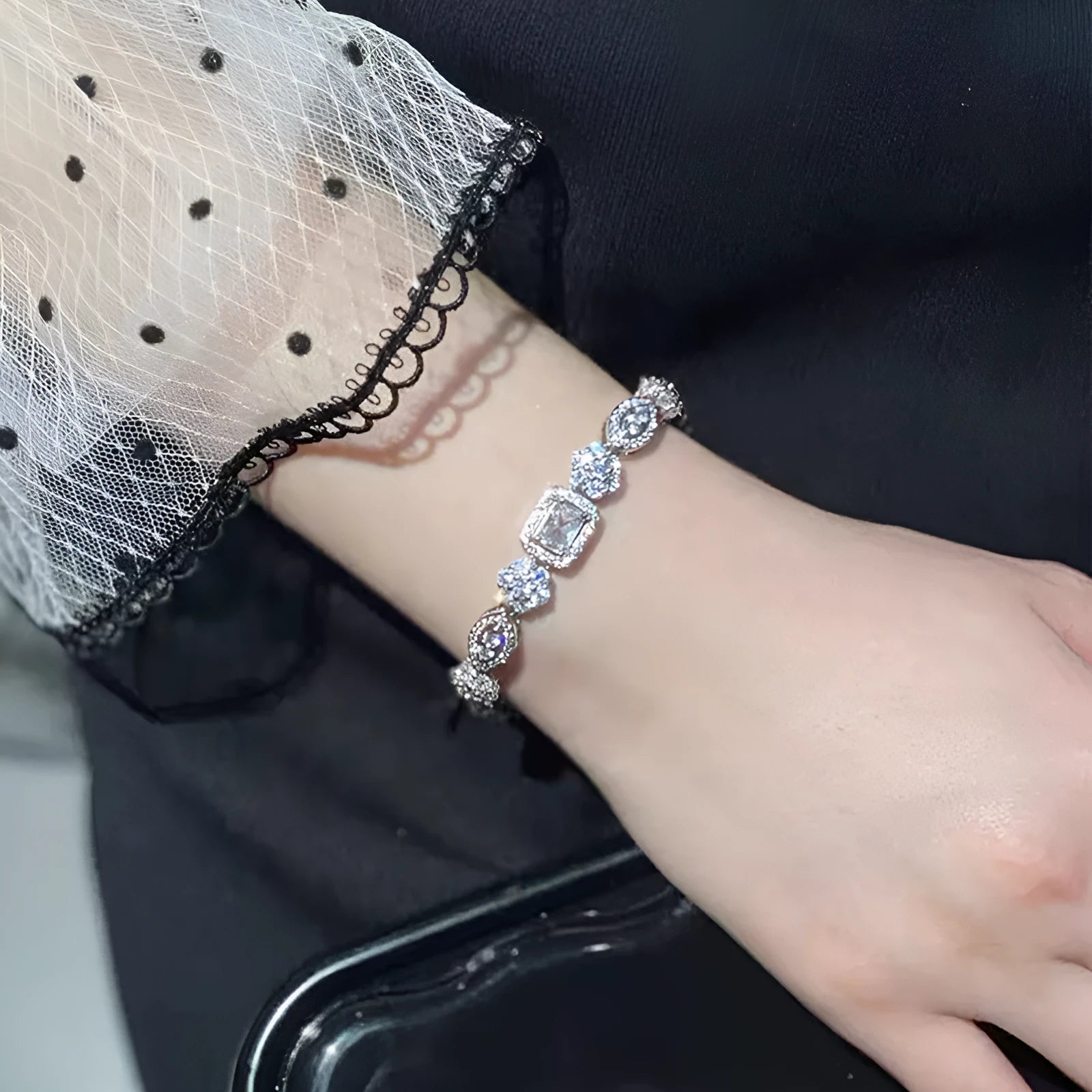 Geometric women's silver bracelet with zircon stones, shown in two length options.