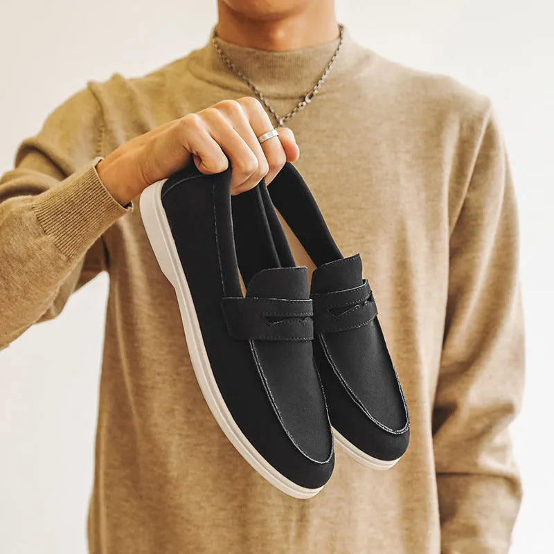 Men's suede leather slip-on casual shoe in a solid colour with a round toe and low flat heel.