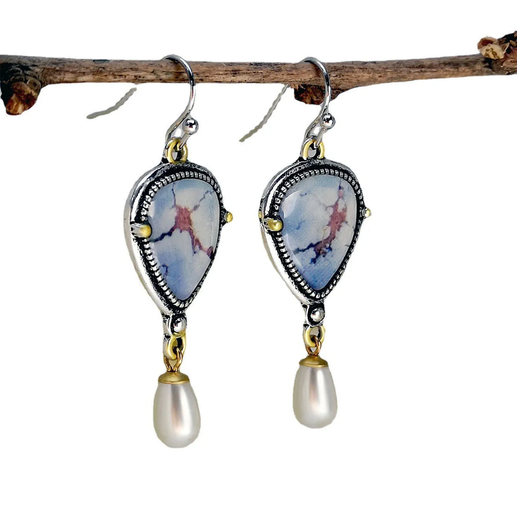 Retro blue drop earrings with electroplated metal, synthetic blue opal, and white pearl components
