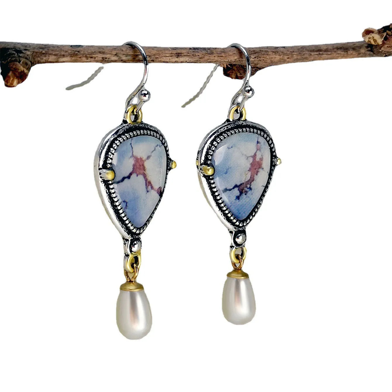 Retro blue drop earrings with electroplated metal, synthetic blue opal, and white pearl components