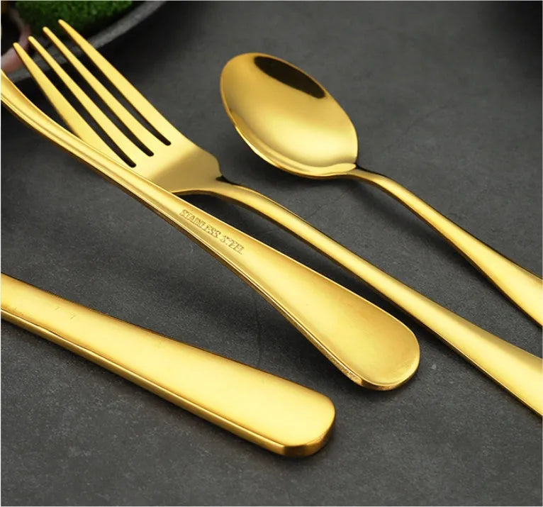 24 piece stainless steel cutlery set showing knives, forks and spoons in various colour finishes with one-piece moulding construction