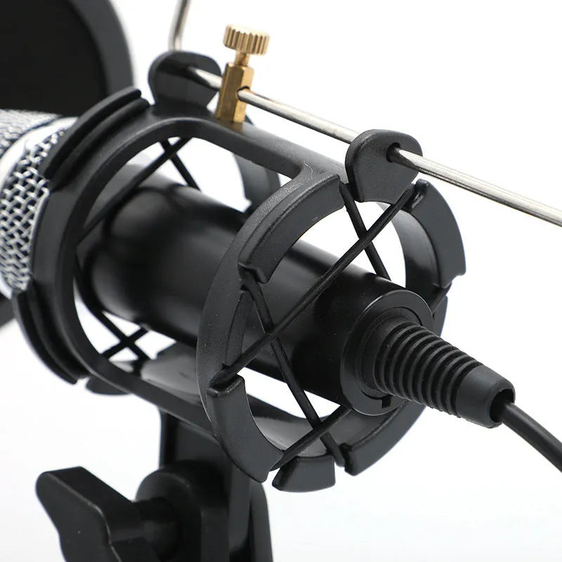 Black mini condenser microphone on an aluminium stand with 3.5mm and USB cables for computer or phone.