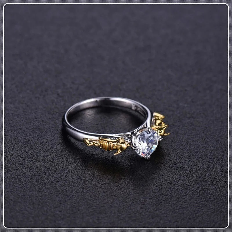 Copper crown motif cosplay ring in a black gold finish.
