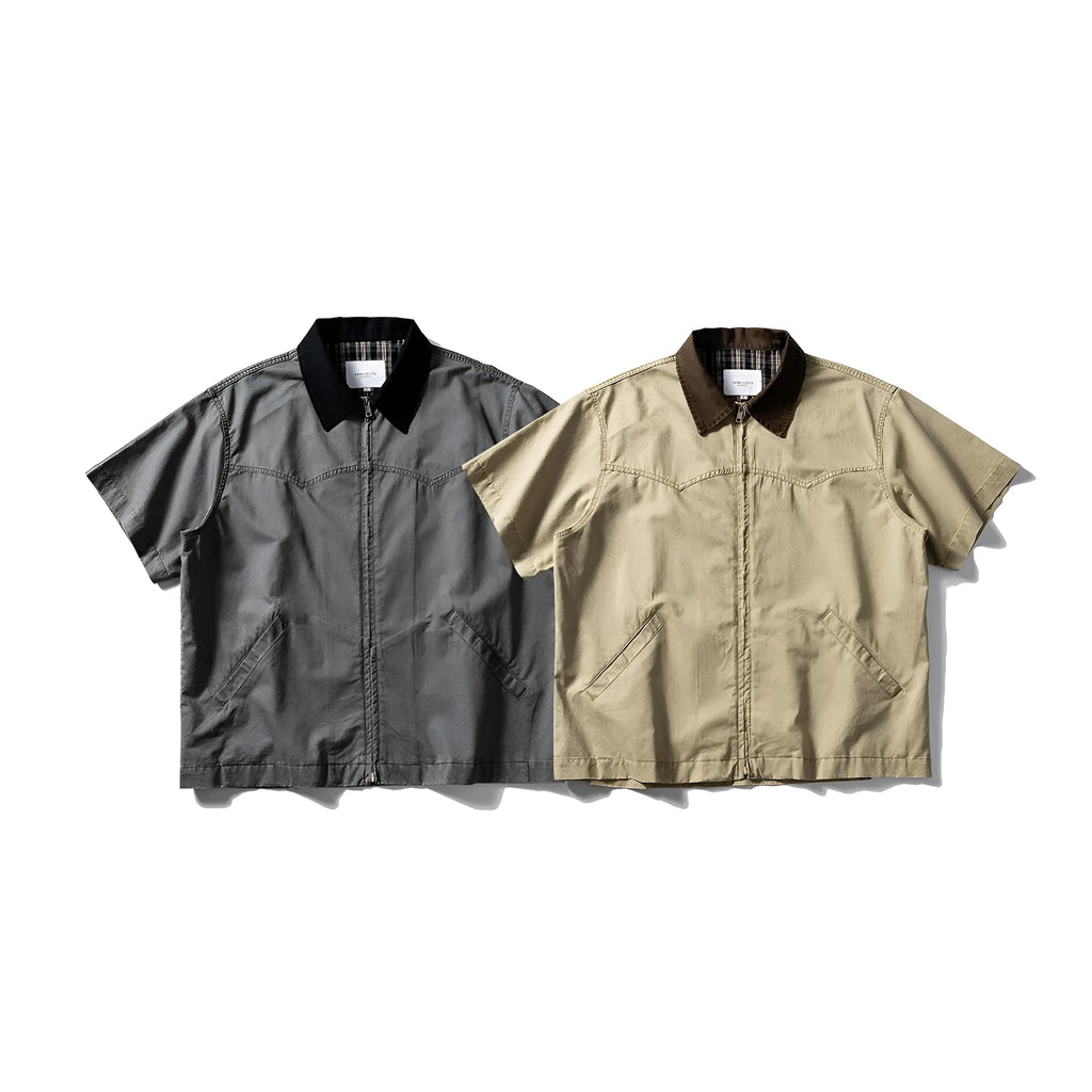 A khaki-coloured, loose-fitting, short-sleeved cotton shirt styled as washed overalls for teenagers