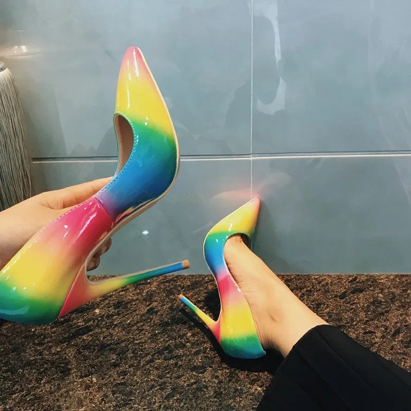 Rainbow coloured patent leather high heels with pointed toe and thin ultra-high heel