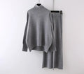 Women's beige acrylic sweater and wide-leg trousers casual two-piece set on a hanger.
