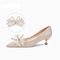 Champagne gold women's stiletto pumps with sequin and crystal decoration, pointed toe, and low top