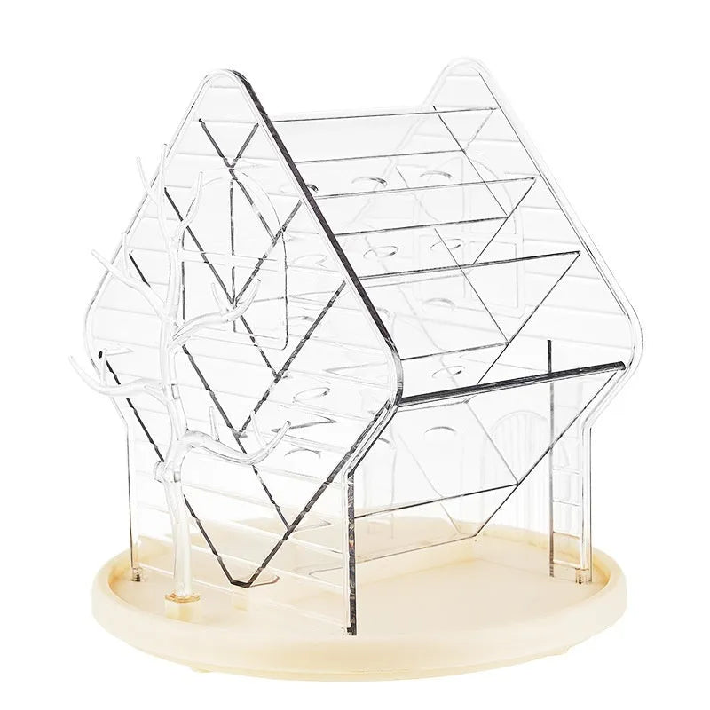 Clear and amber gold rotating cosmetics storage box on a surface