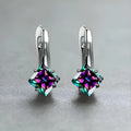 A pair of women's copper earrings with a diamond design featuring inlaid blue zircon stones.