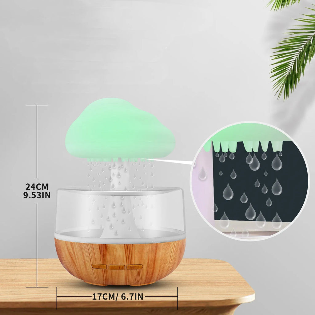 White cloud-shaped ultrasonic humidifier with colourful night light and water droplet flow.